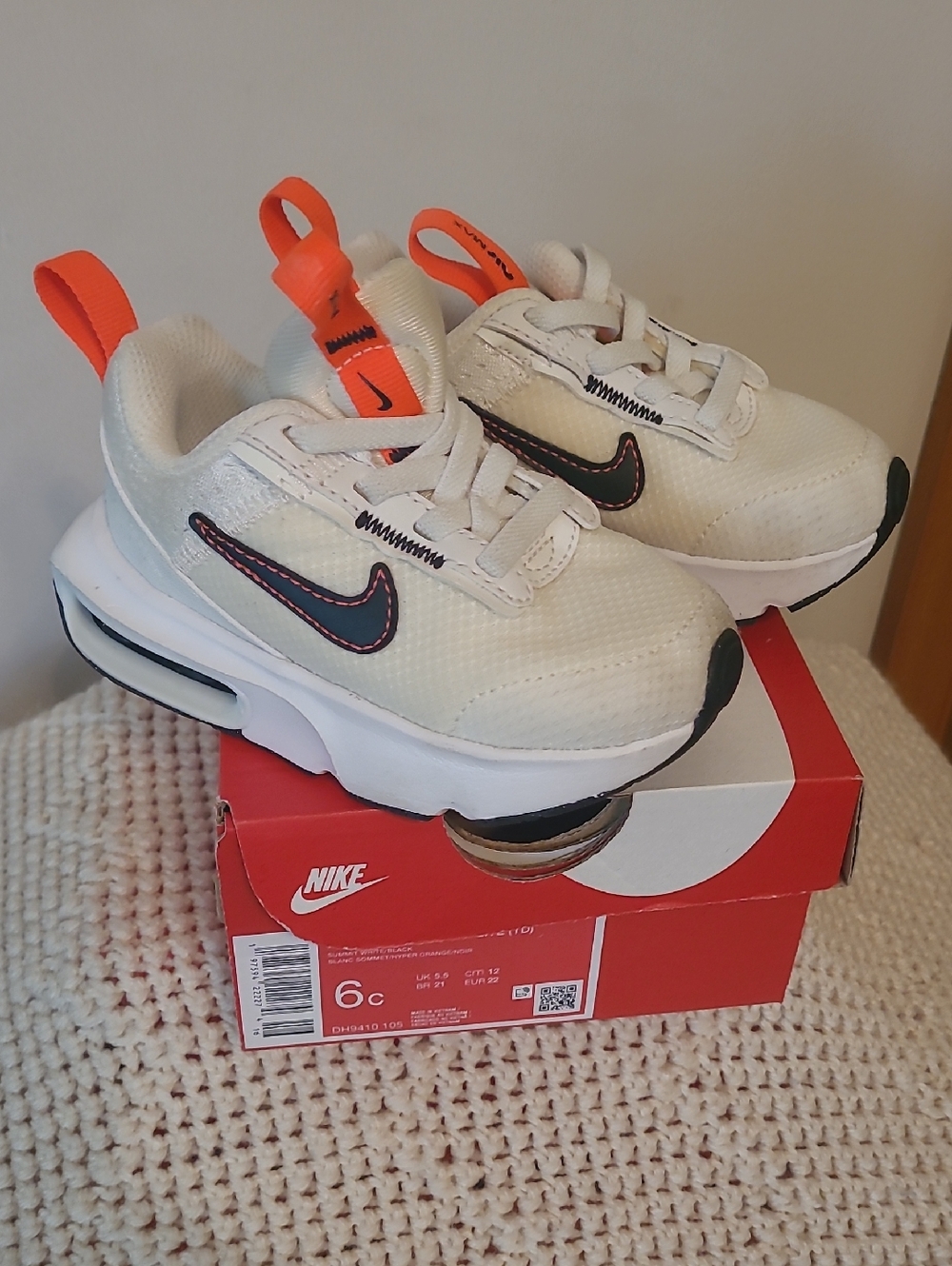 Nike Kids White Sneakers with Orange Pull Tabs and Black Swoosh